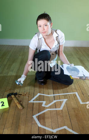 Detective working at crime scene Stock Photo