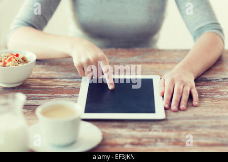 woman pointing finger to tablet pc computer Stock Photo