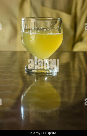 A glass of Poncha stands on a table on the island of Madeira, Portugal. Stock Photo