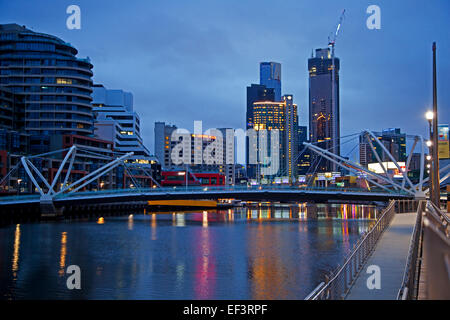 Bridge over the Yarra River and skyline with skyscrapers of the Melbourne City Centre at sunset, Victoria, Australia Stock Photo