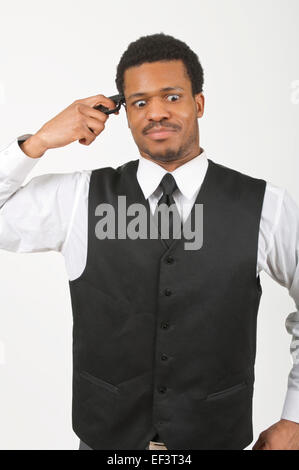 Businessman holding a gun to his head Stock Photo