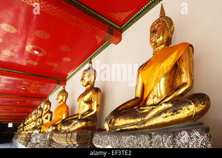 Gold statues of the Buddha abreast, Bangkok, Thailand Stock Photo