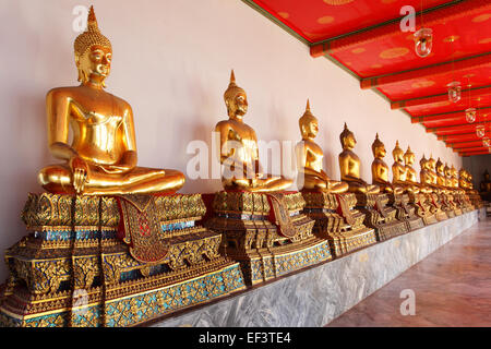 Gold statues of the Buddha abreast, Bangkok, Thailand Stock Photo