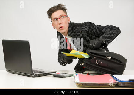 Man stealing a file folder Stock Photo