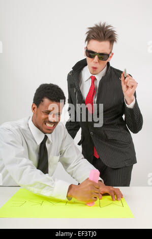 Frustrated man trying to erase a mistake Stock Photo