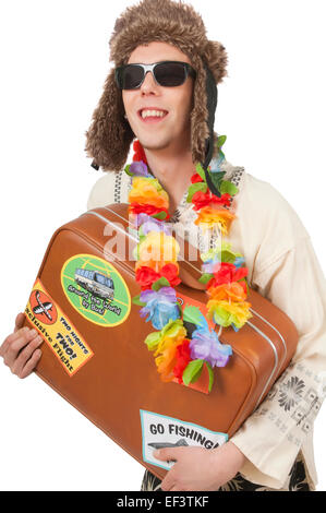 Man wearing winter hat and lei while holding suitcase Stock Photo