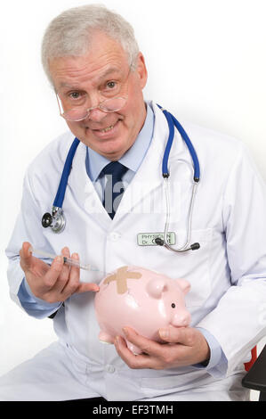 Doctor giving a needle to a piggy bank Stock Photo