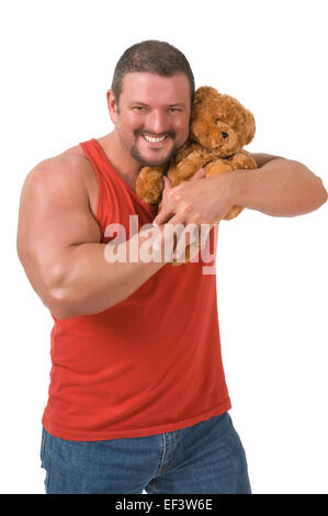 Muscular man cuddling a teddy bear Stock Photo