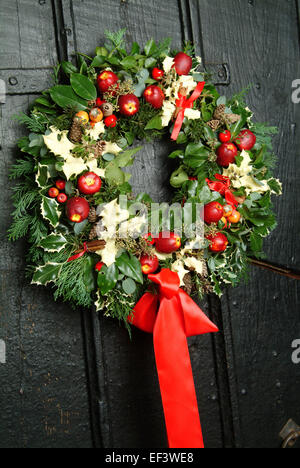 Traditional Christmas door wreath at Little Moreton Hall.a UK Xmas season seasonal decoration decorations'Christmas decorations' Stock Photo