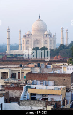 Agra, India, South Asia. Taj Mahal over the rooftops of Taj Ganj neighbourhood t sunset Stock Photo
