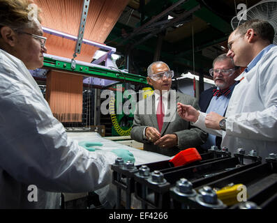 NASA Administrator Charles Bolden, 2nd from left, and Vice President and Orion program manager for Lockheed Martin space systems company Mike Hawes, listen as Bally Ribbon Mills (BRM) Senior R&amp;D Engineer Curt Wilkenson, right, explains how one of their looms works during a tour of the BRM facility on Friday, Jan. 9, 2015 in Bally, PA. BRM is weaving the multifunctional 3D thermal protection system padding used to insulate and protect NASA's Orion spacecraft. NASA's recently-tested Orion spacecraft will carry astronauts to Mars and return them safely back to Earth with the help of BRM techn Stock Photo