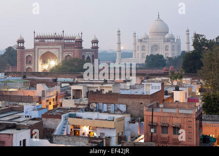 Agra, Uttar Pradesh, India, South Asia. Taj Mahal and mosque seen from across the Taj Ganj neighbourhood. Dusk Stock Photo