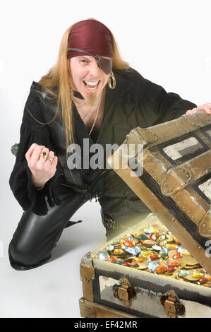 Pirate opening up a treasure chest Stock Photo