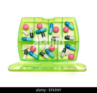 Box with a weekly dosage of various drugs on a white background. Stock Photo