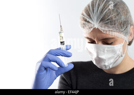 Vaccine Concept. Female Portrait Of Caucasian Girl Holding A Syringe 