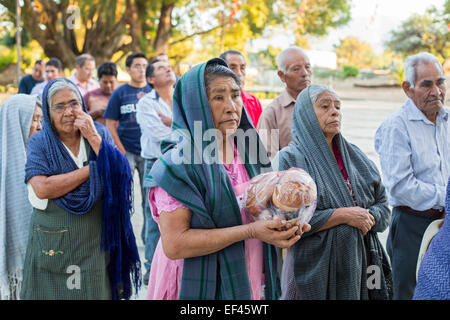 San Sebastian Abasolo, Oaxaca, Mexico - Parishoners wait to enter San Sebastian Abasolo Catholic church for mass. Stock Photo