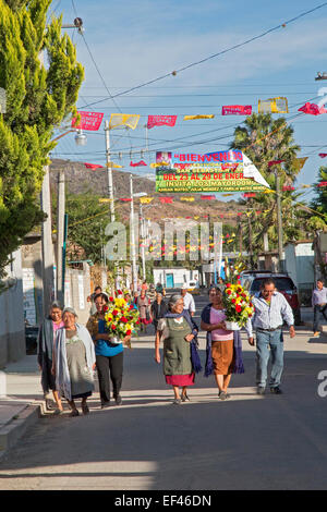 San Sebastian Abasolo, Oaxaca, Mexico - Parishoners walk to the San Sebastian Abasolo Catholic church for mass. Stock Photo