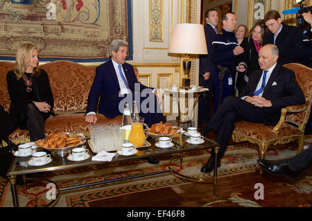 U.S. Secretary of State John Kerry and U.S. Ambassador to France Jane Hartley sit with French Foreign Minister Laurent Fabius at the Quai d'Orsay for a bilateral meeting before the Secretary paid homage on January 16, 2015, to the victims of last week's shooting attacks in Paris, France. Stock Photo