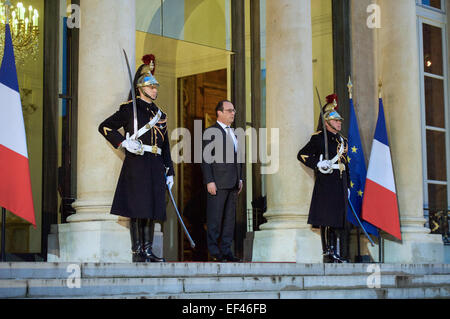 French President François Hollande prepares to welcome U.S. Secretary of State John Kerry to the Élysée Palace for a bilateral meeting in Paris, France, on January 16, 2015. The Secretary is visiting the French capital to pay homage to the victims of last week's shooting attacks in Paris and to reiterate the support of the United States for the French people and our ongoing commitment to providing any assistance needed. Stock Photo