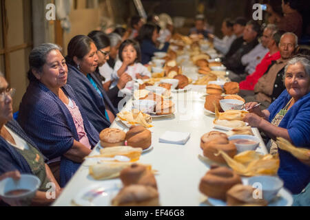 San Sebastian Abasolo, Oaxaca, Mexico - Residents of San Sebastian Abasolo share a meal. Stock Photo