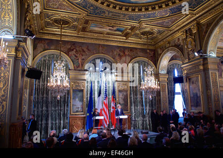 U.S. Secretary of State John Kerry, flanked by Mayor Anne Hidalgo, addresses an audience at City Hall in Paris, France, on January 16, 2015, as he pays tribute to the victims of last week's shooting spree in the city. Stock Photo