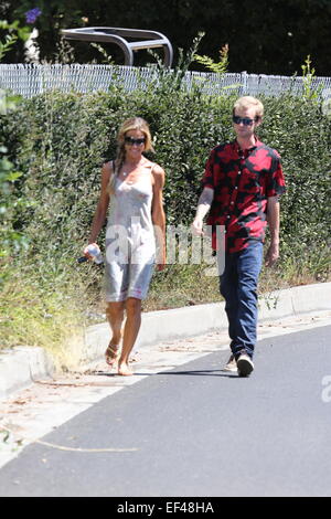 Denise Richards out and about in Beverly Hills wearing a white summer dress and a hair braid  Featuring: Denise Richards Where: Los Angeles, California, United States When: 24 Jul 2014 Stock Photo