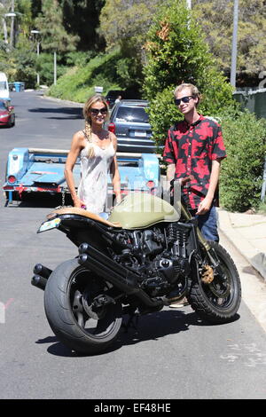 Denise Richards out and about in Beverly Hills wearing a white summer dress and a hair braid  Featuring: Denise Richards Where: Los Angeles, California, United States When: 24 Jul 2014 Stock Photo