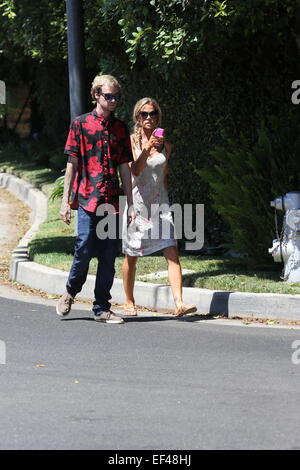 Denise Richards out and about in Beverly Hills wearing a white summer dress and a hair braid  Featuring: Denise Richards Where: Los Angeles, California, United States When: 24 Jul 2014 Stock Photo