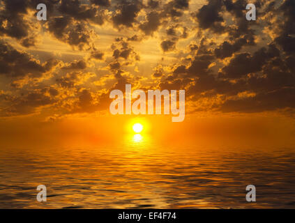 sunset over water Stock Photo