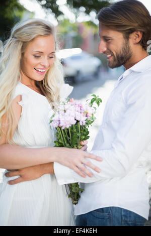 Attractive couple with bunch of flowers Stock Photo - Alamy