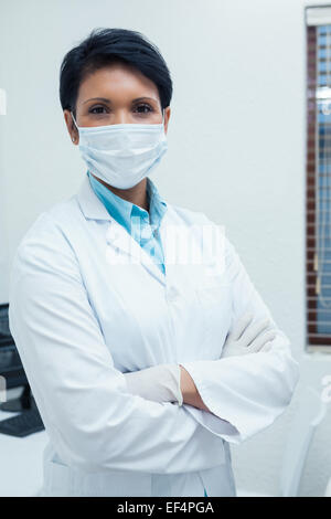Female dentist wearing surgical mask Stock Photo
