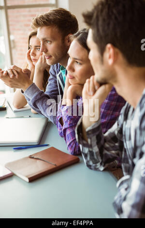 Young adult friends students studying and talking together Stock Photo ...