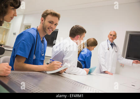 Medical student smiling at the camera during class Stock Photo