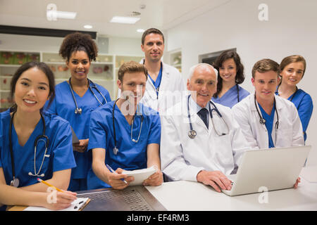 Medical students and professor smiling at camera Stock Photo