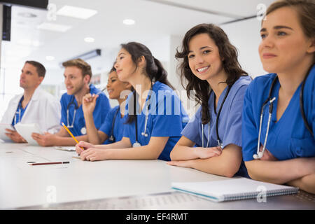 Medical student smiling at the camera during class Stock Photo