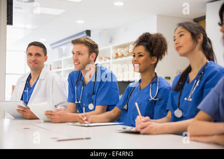 Medical student smiling at the camera during class Stock Photo