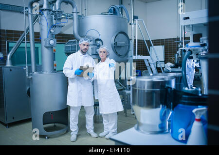 Food technicians working together Stock Photo