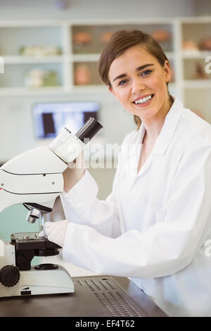 Young scientist working with microscope Stock Photo