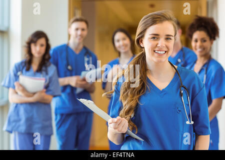 Medical students smiling at the camera Stock Photo