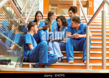 Medical students taking a break on the steps Stock Photo