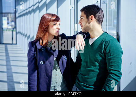 Happy young couple in airport building Stock Photo