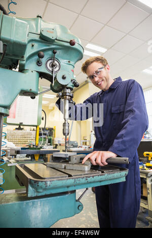 Engineering student using large drill Stock Photo