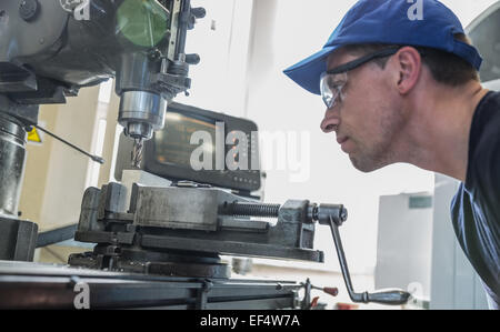 Engineering student using large drill Stock Photo