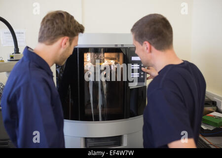 Engineering students using 3d printer Stock Photo