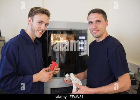 Engineering students using 3d printer Stock Photo