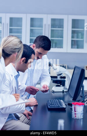 Science students working together in the lab Stock Photo