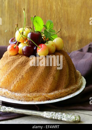 Easter festive fruitcake decorated with fresh cherries Stock Photo