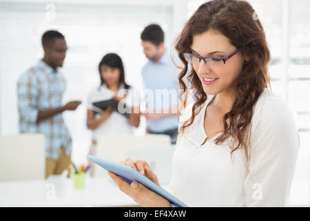 Smiling businesswoman using tablet pc Stock Photo