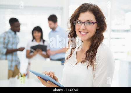 Smiling businesswoman using tablet pc Stock Photo