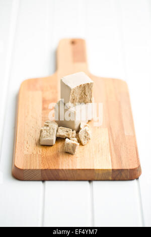 fresh yeast on cutting board Stock Photo